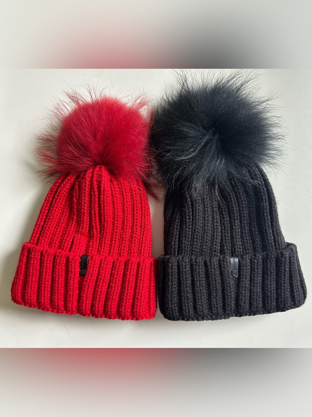 NWT RUDSAK Women Pom Pom Beanie Hats, Set of 2, Red and Black.